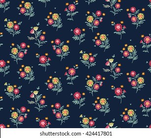 Cute pattern in small flower. Small colorful  flowers. Dark blue background. Ditsy floral background. The elegant the template for fashion prints.