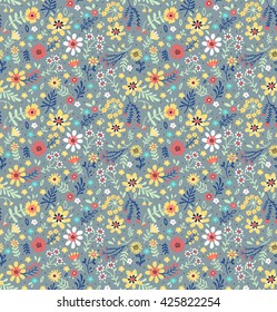 Cute pattern in small flower. Small colorful flowers. Light blue background. Ditsy floral background. The elegant the template for fashion prints.