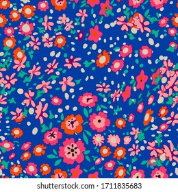 Cute pattern in a small flower. Little colorful flowers. Colorful and bright summer silhouette. Abstract seamless pattern with leaves and flowers. Background with floral vector for modern style.