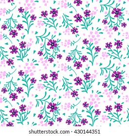 Cute pattern in small flower. Small purple flowers. White background. Ditsy floral background. The elegant the template for fashion prints.