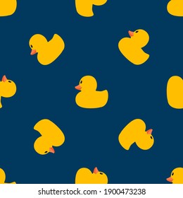 Cute pattern with yellow ducks on a blue background