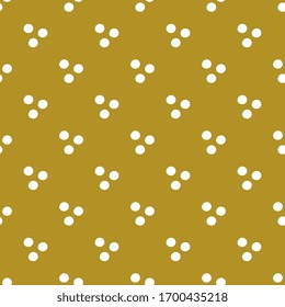 Cute patterns with white polka on a gold background. Festive fashionable design. Seamless vector illustration. For textiles, surfaces, packaging.