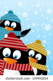 Cute penguins on winter background