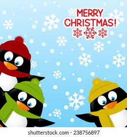 Cute penguins on winter background