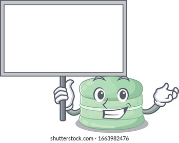 A cute picture of pistachio macaron mascot design with a board