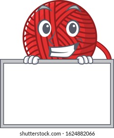 A cute picture of red wool yarn grinning with board