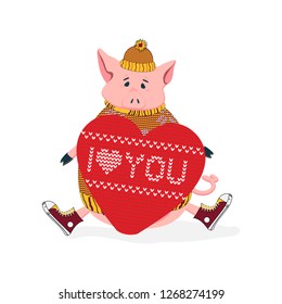The cute pigi in a yellow hat, sweater and sneakers holding a knitted heart with the words "I love you" for the celebration of St. Valentine's Day. Hand-drawn. Vector illustration.