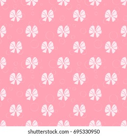Cute pink background with bows. Seamless pattern.
