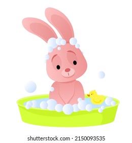 Cute pink bunny takes a bubble bath