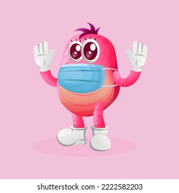Cute pink monster wearing medical mask, protect from covid-19. Perfect for kids, small business or e-Commerce, merchandise and sticker, banner promotion, blog or vlog channel
