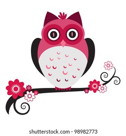 A cute pink owl on a flowering tree branch.