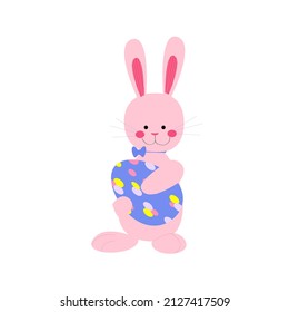 Cute pink rabbit is holding a decorated egg. Vector easter bunny isolated on white background. Easter illustration with a hare.