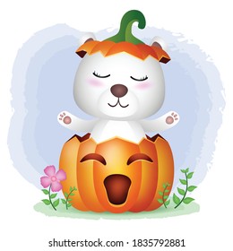 a cute polar bear in the halloween pumpkin