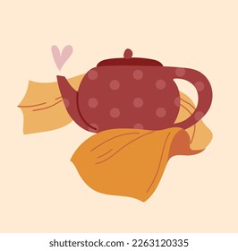 Cute porcelain tea pot folded in a yellow towel. Cozy kitchen scene. Tea time concept