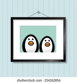 Cute Portrait of Penguin Couple in Picture Frame Hanging on Blue Wallpaper Background