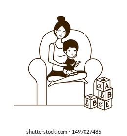 cute pregnancy mother with little boy seated in sofa