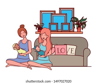 cute pregnancy mothers seated lifting little babies in the bedroom