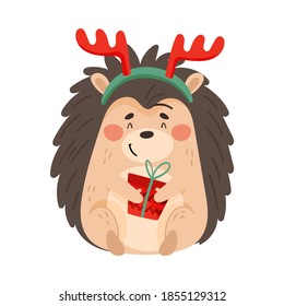 Cute Prickly Hedgehog Wearing Reindeer Antler Holding Wrapped Gift Box Vector Illustration
