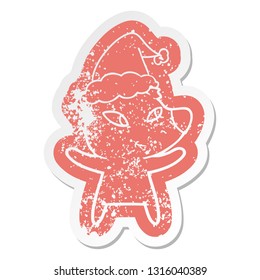 cute quirky cartoon distressed sticker of a bear wearing santa hat