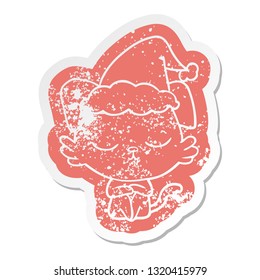 cute quirky cartoon distressed sticker of a dog wearing santa hat