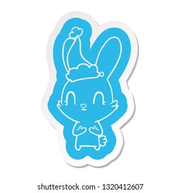 cute quirky cartoon  sticker of a rabbit wearing santa hat