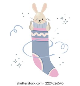 Cute rabbit in a Christmas sock. Merry Christmas. Funny rabbit in a Christmas stocking shows thumbs up.Vector isolated design on the background of stars and serpentine.Pastel colors.