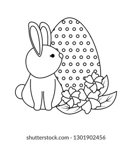 cute rabbit with easter egg painted in the garden