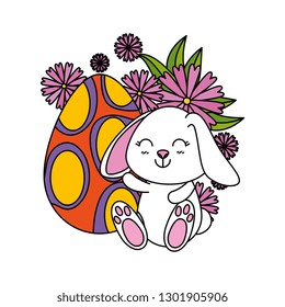 cute rabbit with easter egg painted in the garden