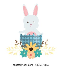 cute rabbit with easter egg painted and flowers