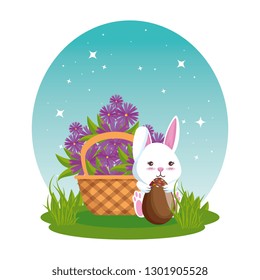 cute rabbit with easter eggs painted in basket and flowers