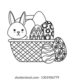 cute rabbit with easter eggs painted in basket
