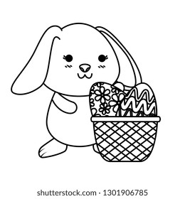 cute rabbit with easter eggs painted in basket