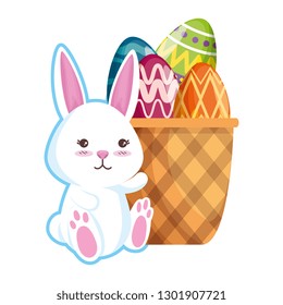 cute rabbit with easter eggs painted in basket