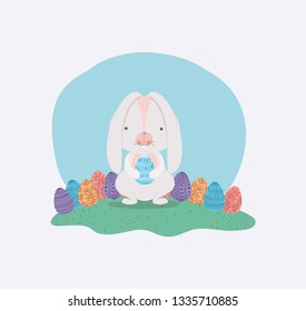 cute rabbit with easter eggs painted in the camp