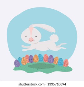 cute rabbit with easter eggs painted in the camp
