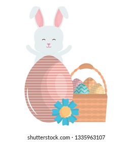 cute rabbit with easter eggs painted in basket