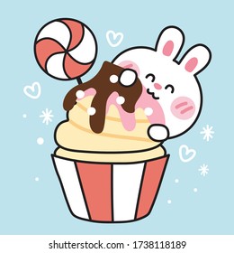 Cute Rabbit eat cupcake hand drawn on blue background.Animal doodle.Hand drawn.Kawaii.Vector.Illustration.