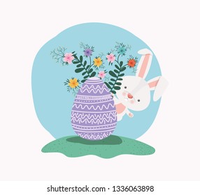 cute rabbit with egg painted and flowers in the garden