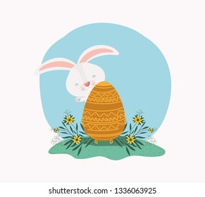 cute rabbit with egg painted and flowers in the garden