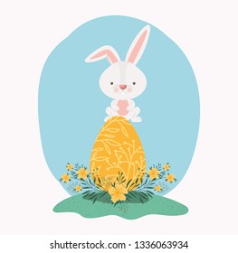 cute rabbit with egg painted and flowers in the garden