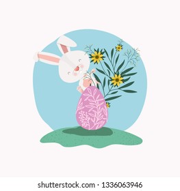 cute rabbit with egg painted and flowers in the garden
