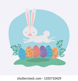 cute rabbit with eggs painted and leafs in the garden