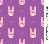 Cute rabbit face on purple background, vector seamless pattern