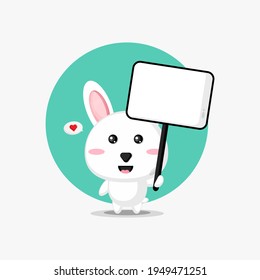 Cute rabbit holding a blank sign