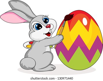 Cute rabbit painting an Easter egg