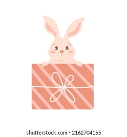 Cute rabbit peeks out of gift box. Vector illustration for Christmas card, birthday greetings with funny cartoon baby animal head. Bunny hide in wrapped present. Adorable hare.