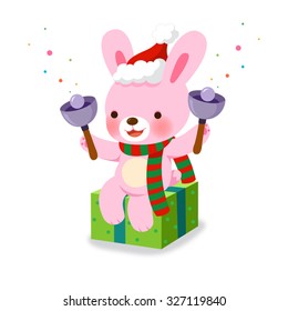 Cute rabbit ringing Christmas hand bells on white background