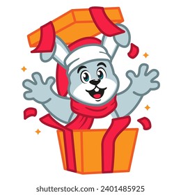 Conejo lindo en un Sombrero de Santa y bufanda roja en un regalo de Navidad