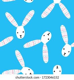 Cute rabbit seamless pattern. White bunnies heads on blue background. Funny hare with long ears. Adorable baby design for print, textile, fabric, wallpaper. Stock vector illustration drawn by hand.