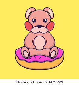 Cute rabbit is sitting on donuts.